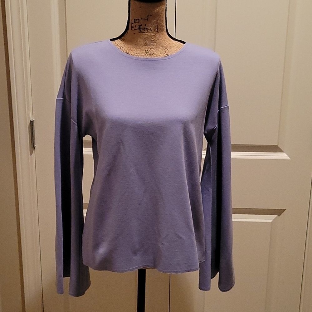 Topshop. Unique lavender top with bell sleeves and an open back. NWT
